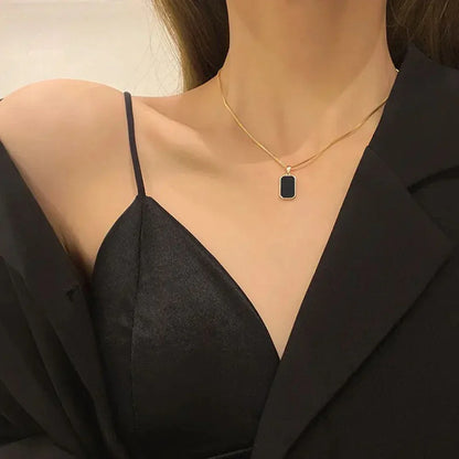 Reversible Gold Rectangle Pendant Necklace – Black Onyx & White Mother of Pearl